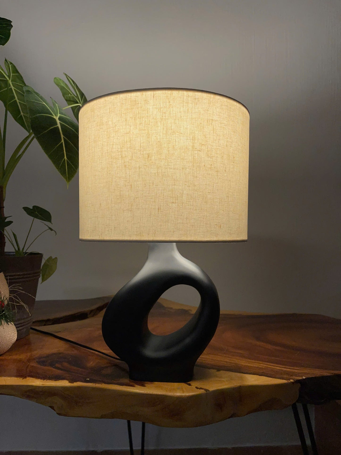ORBITAL VOID A Sculptural Wooden Table Lamp with Matte Black Eleganc